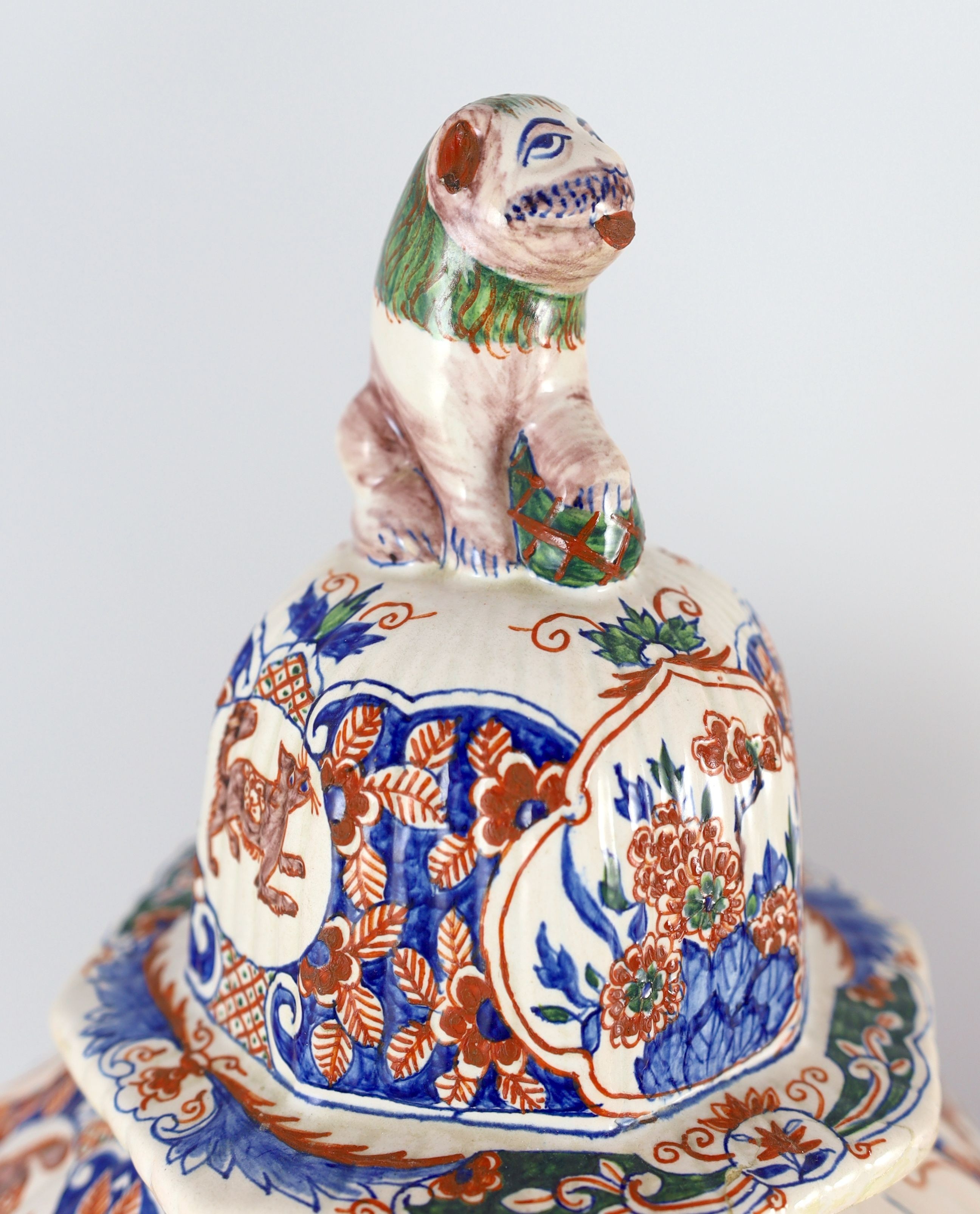 A pair of large Delft jars and covers, Pieter Kocx factory De Grieksche A, c.1701-1722, 50.5cm high, damage to covers